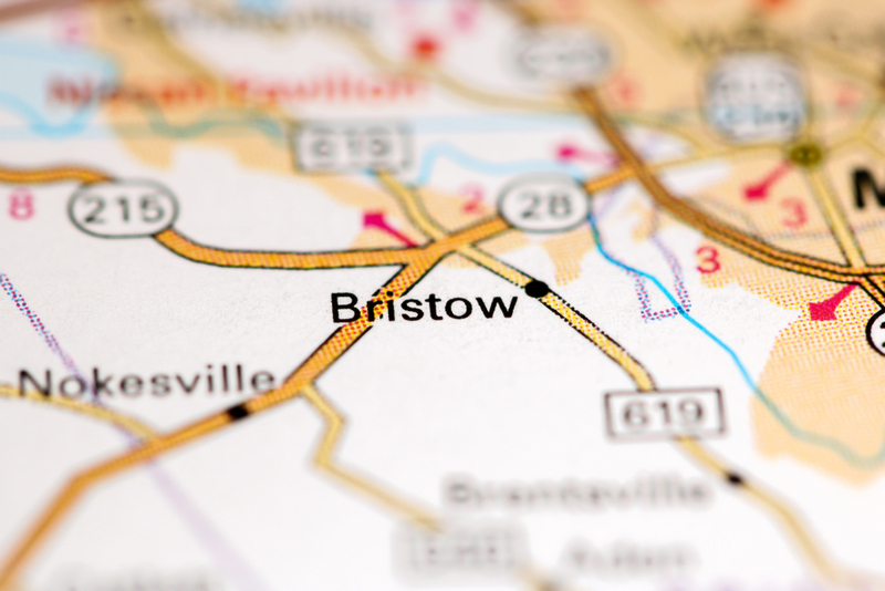 A close-up photograph of a printed road map focusing on the town of Bristow, Virginia.