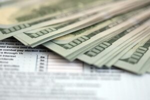 Big amount of United States hundred dollar bills on table