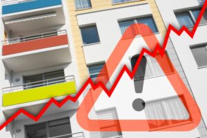 Rising graph in front of renovated municipal apartments
