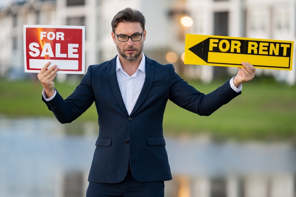 House seller, real estate agents hold sign for sale or rent