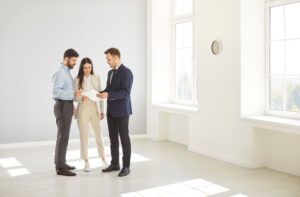 married family couple of clients consulting with a realtor