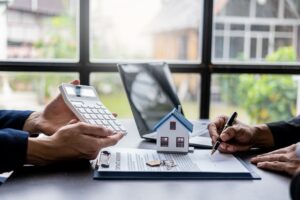 real estate agent discusses the terms of the home purchase agreement