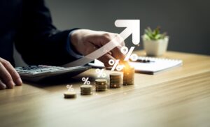 usiness people calculate and higher graphs and percentages investment