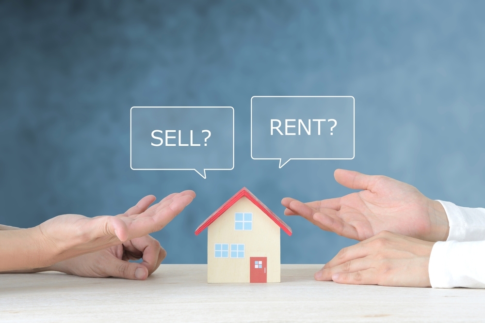 Hands of people discussing selling or renting house