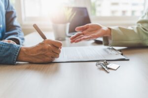 Real estate agent or realtor landlord advice buyer client to sign mortgage document